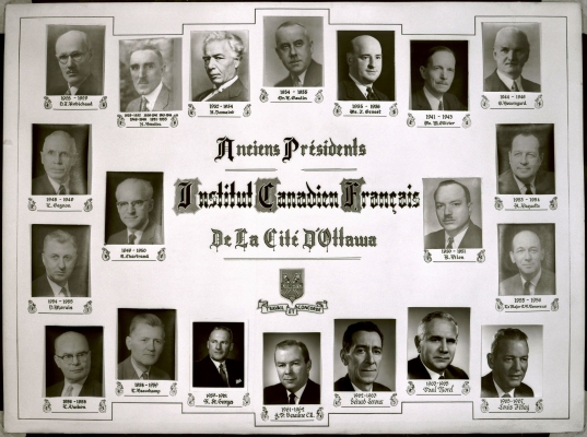 Photograph of a display board with 20 black and white studio photographs, each depicting a man in a suit, in profile or full face view. Names and dates of his presidency appear under the photographs. A title is printed in large black characters preceded by dropped capital letters. Coat of arms and motto are displayed.