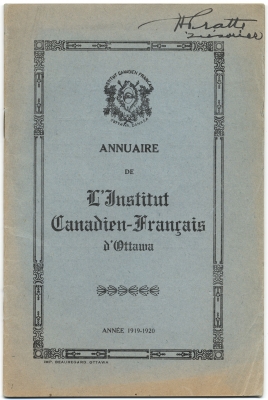 Cover of a French document on blue card stock. The title of the document is  in the centre of the page, surrounded by a decorative border. The organization’s coat of arms appears at the top of the page. Unreadable words are written in black ink in the upper right corner.